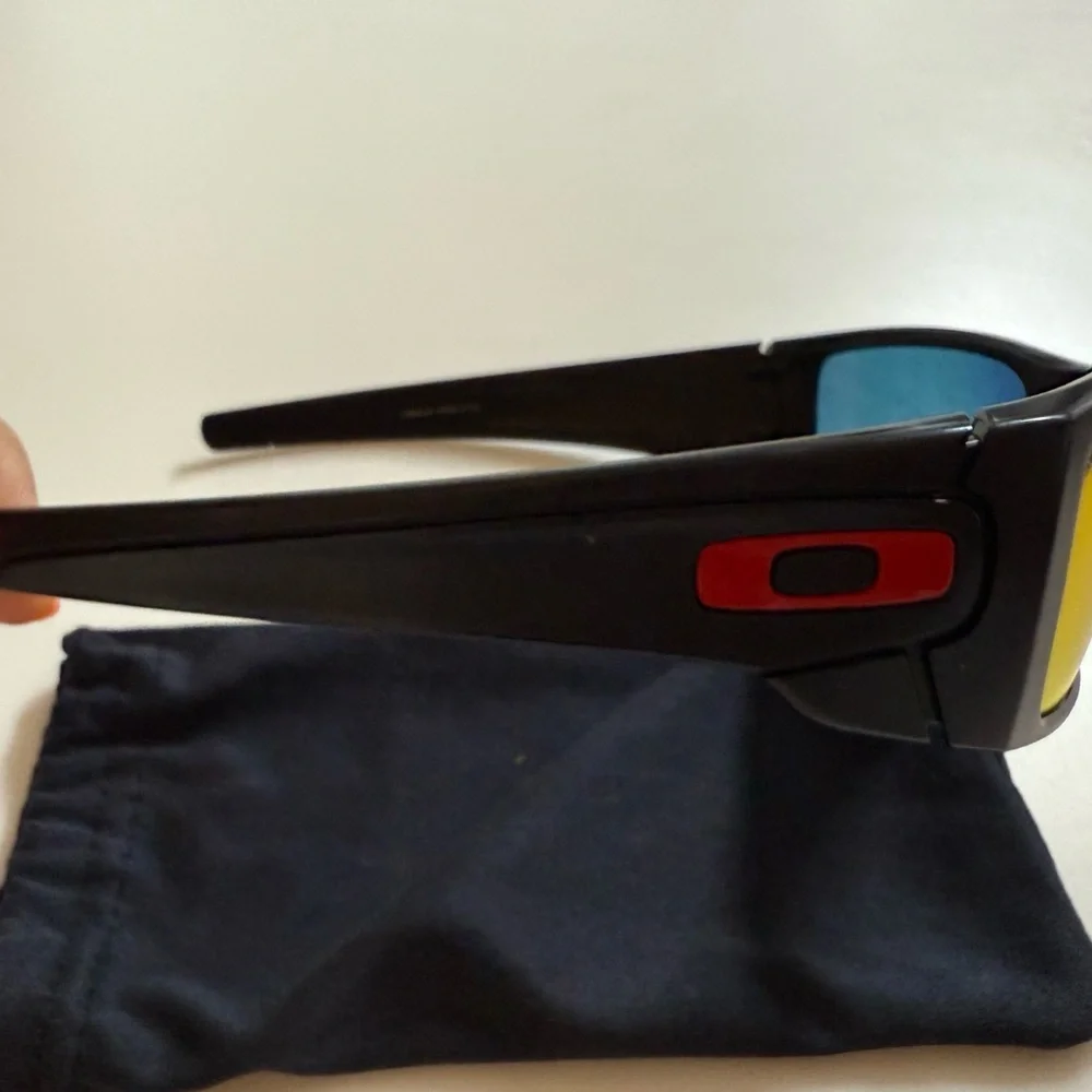 Used Oakley Black and Red Lens Sunglasses